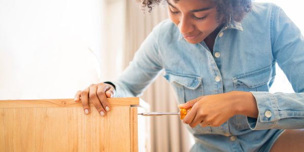 woman-assembling-furniture-at-home-with-screwdrive-2026-01-11-09-54-26-utc